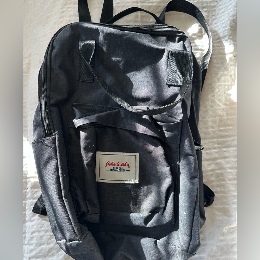 Small black canvas backpack